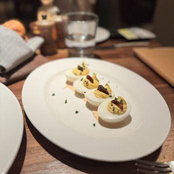 Corinne San Antonio signature dishes Chorizo Deviled EggsLongbone Pork RibeyeGrilled Oysters